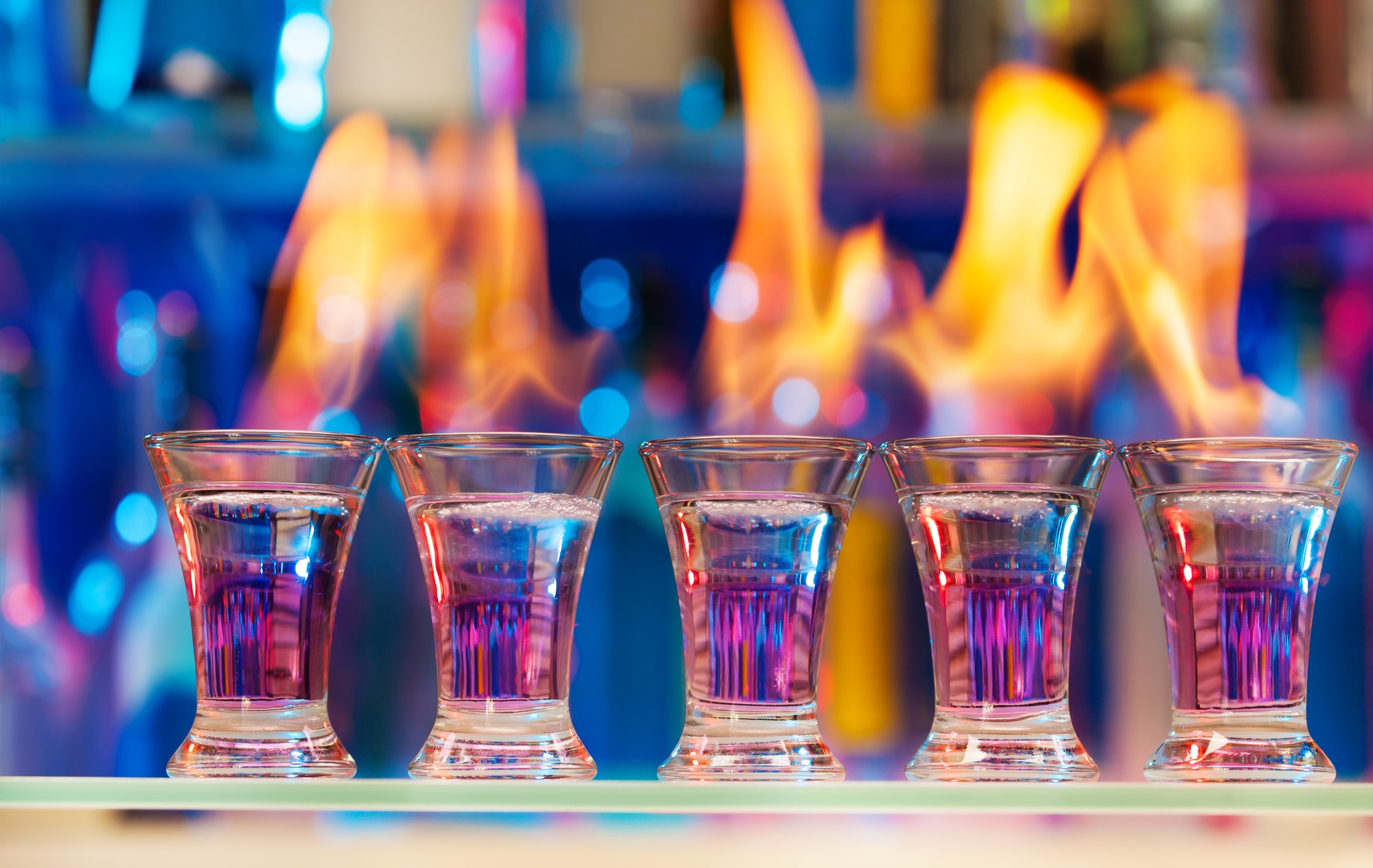 flaming shots on a bar