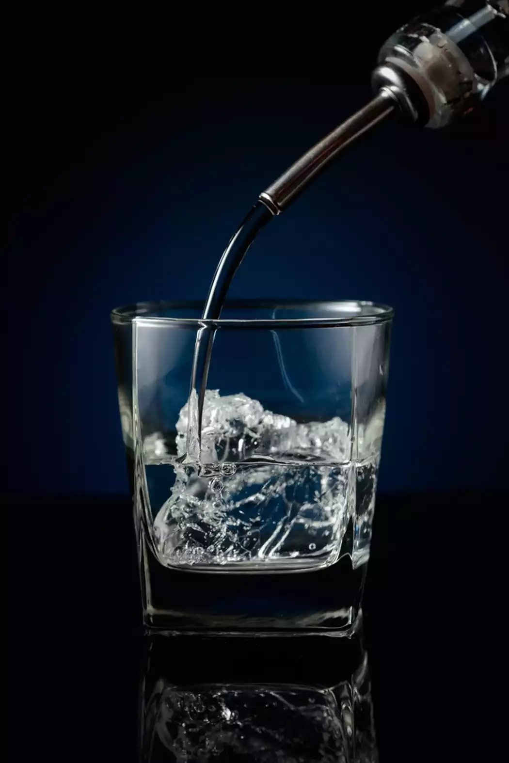 Vodka fills a shot glass, but without proper systems, it’s likely the drink is overpoured.