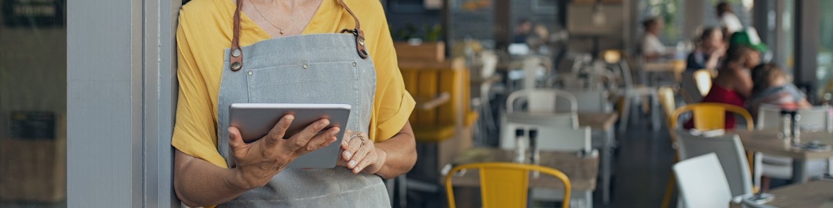 restaurant owner on tablet