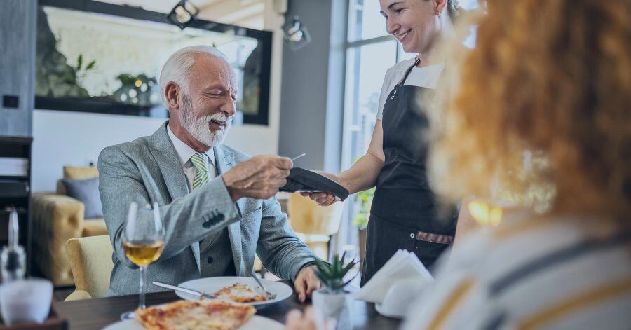 man paying restaurant bill